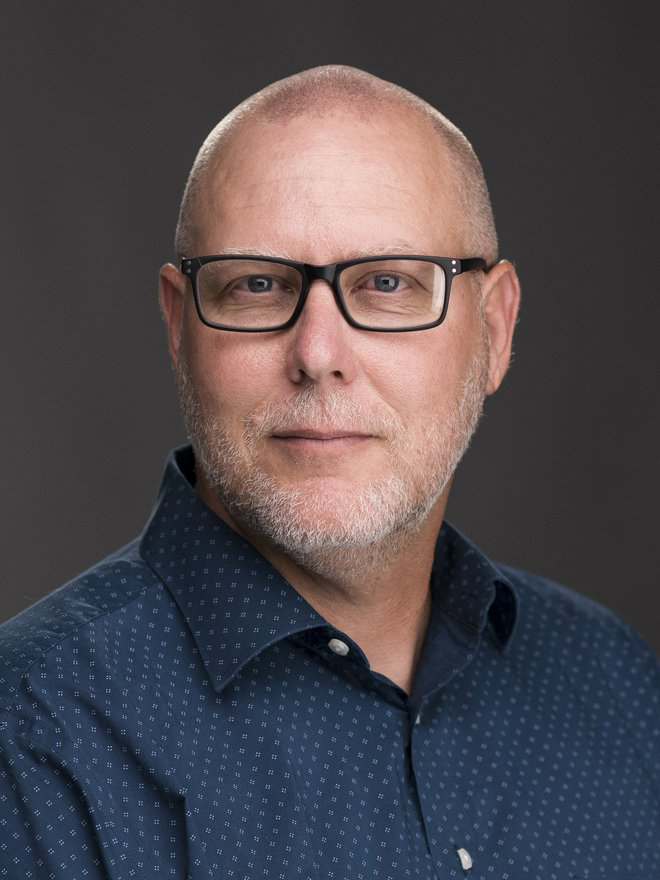 Close up headshot of a man (John Decker)